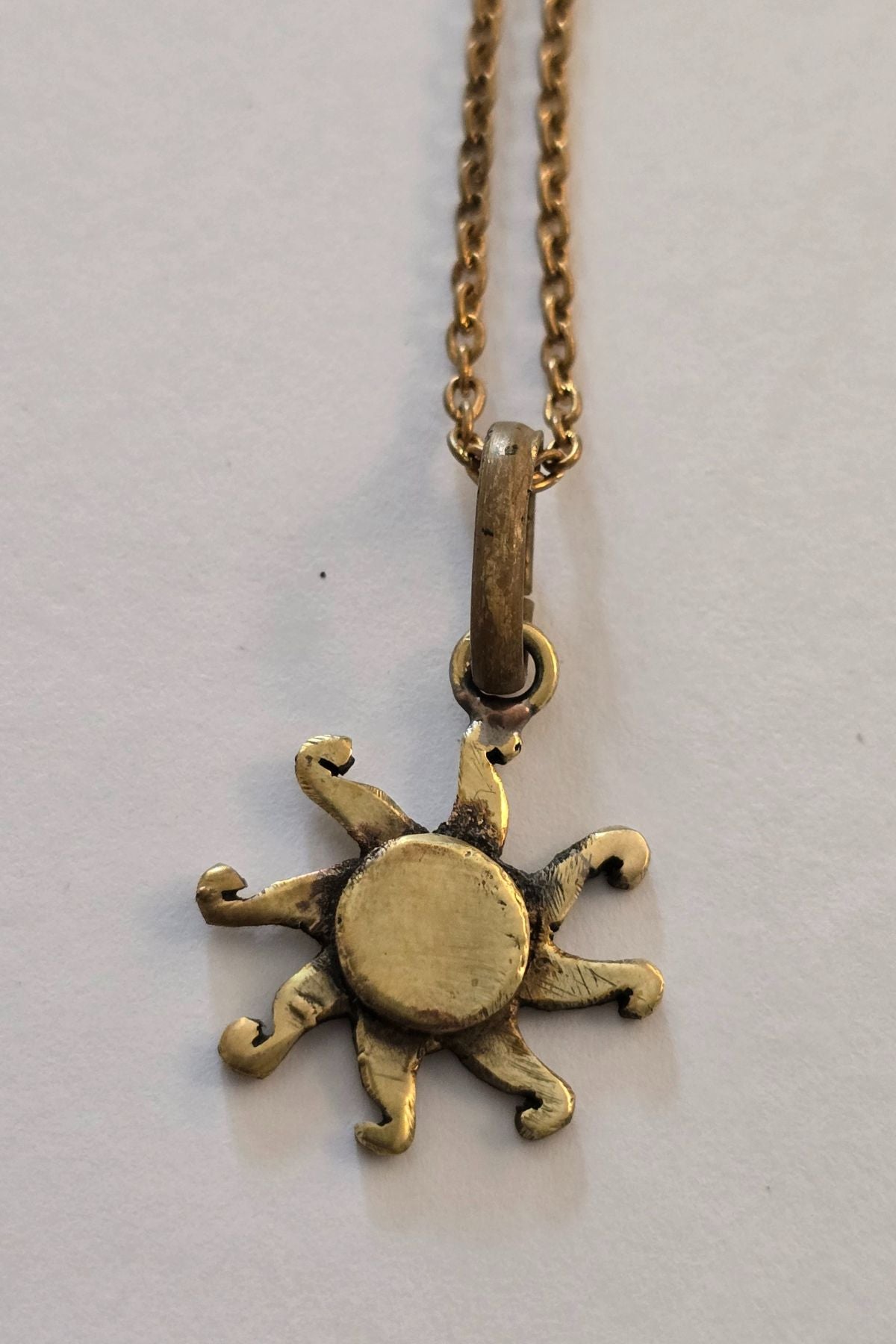 Dancing Sun Charm