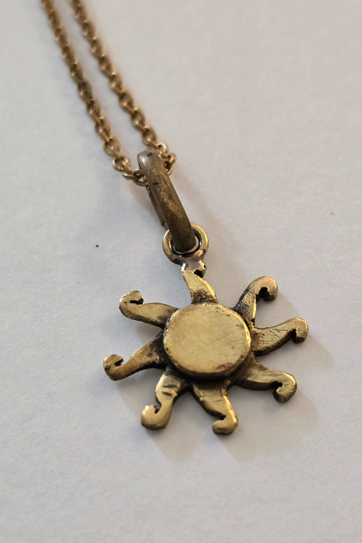 Dancing Sun Charm